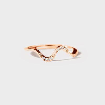a rose gold ring with a wave design