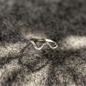 a close up of a ring on a blanket