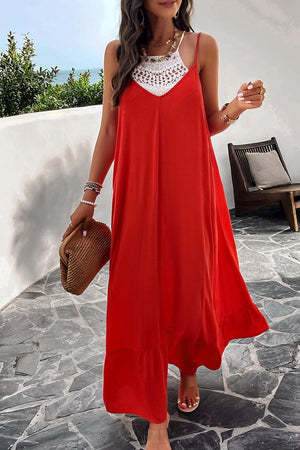 a woman wearing a red dress and a straw hat