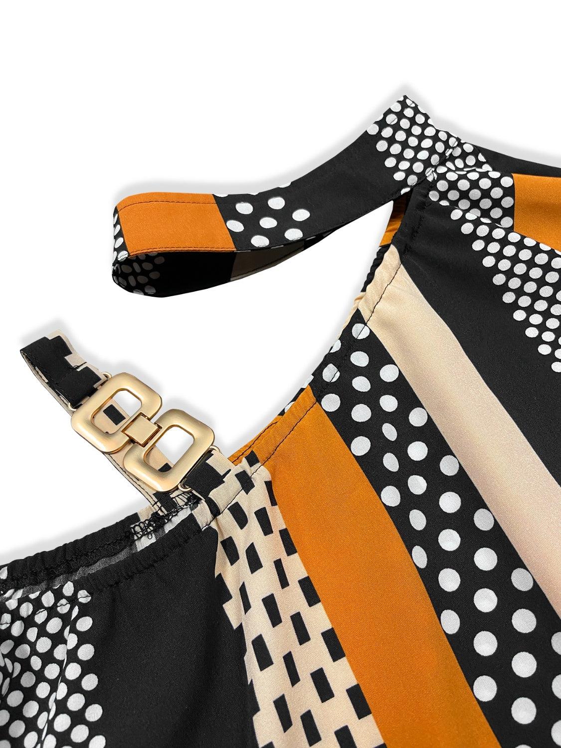 a black and white polka dot dress with a gold buckle