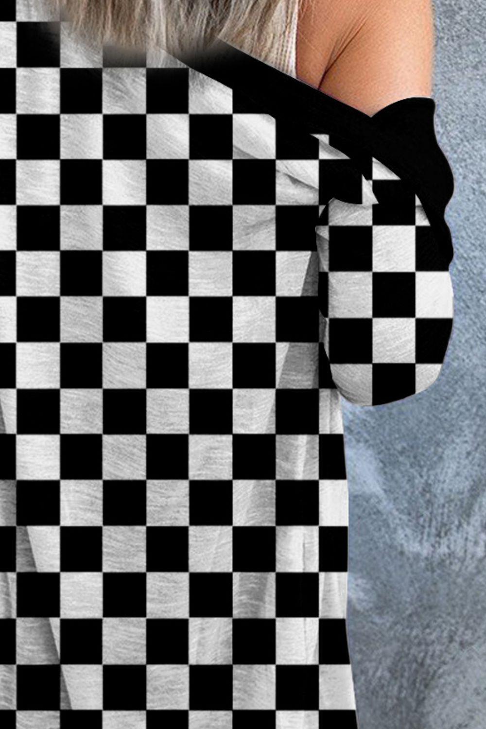 a woman wearing a black and white checkered shirt