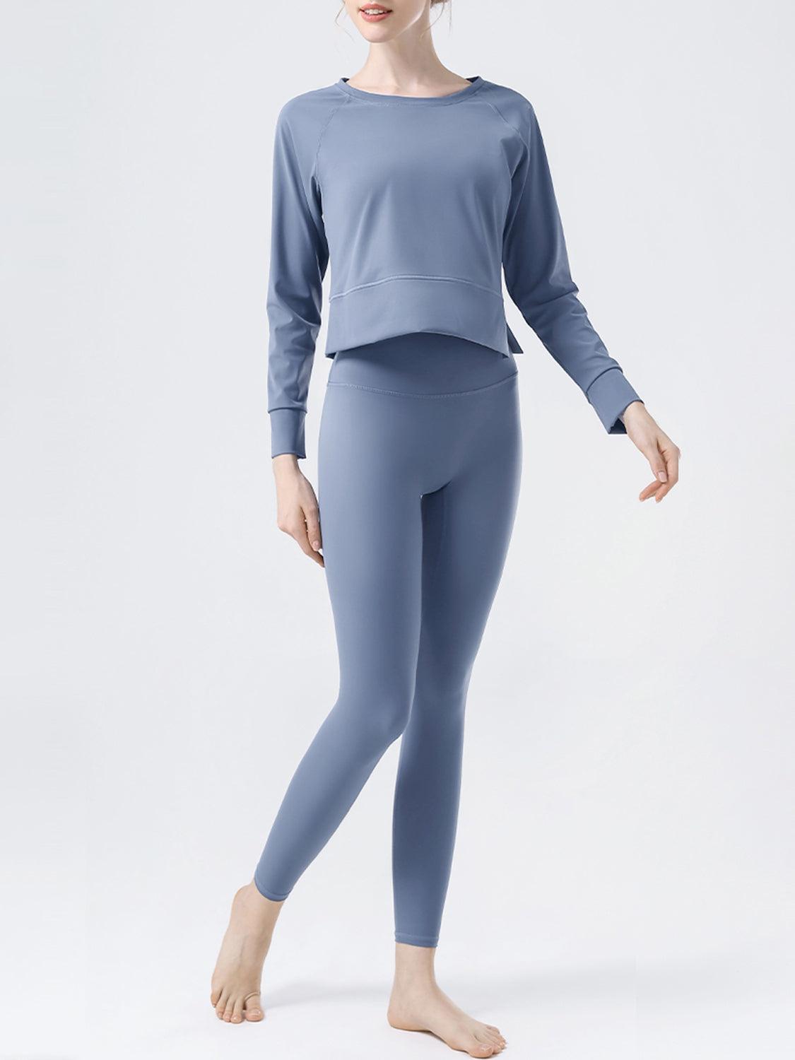 a woman in a blue top and leggings