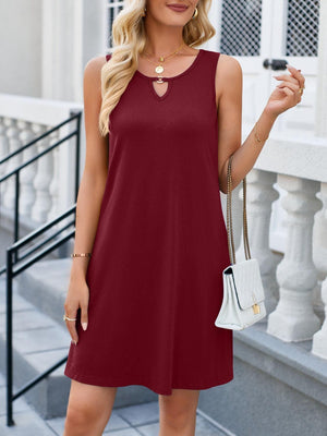 a woman in a red dress posing for the camera