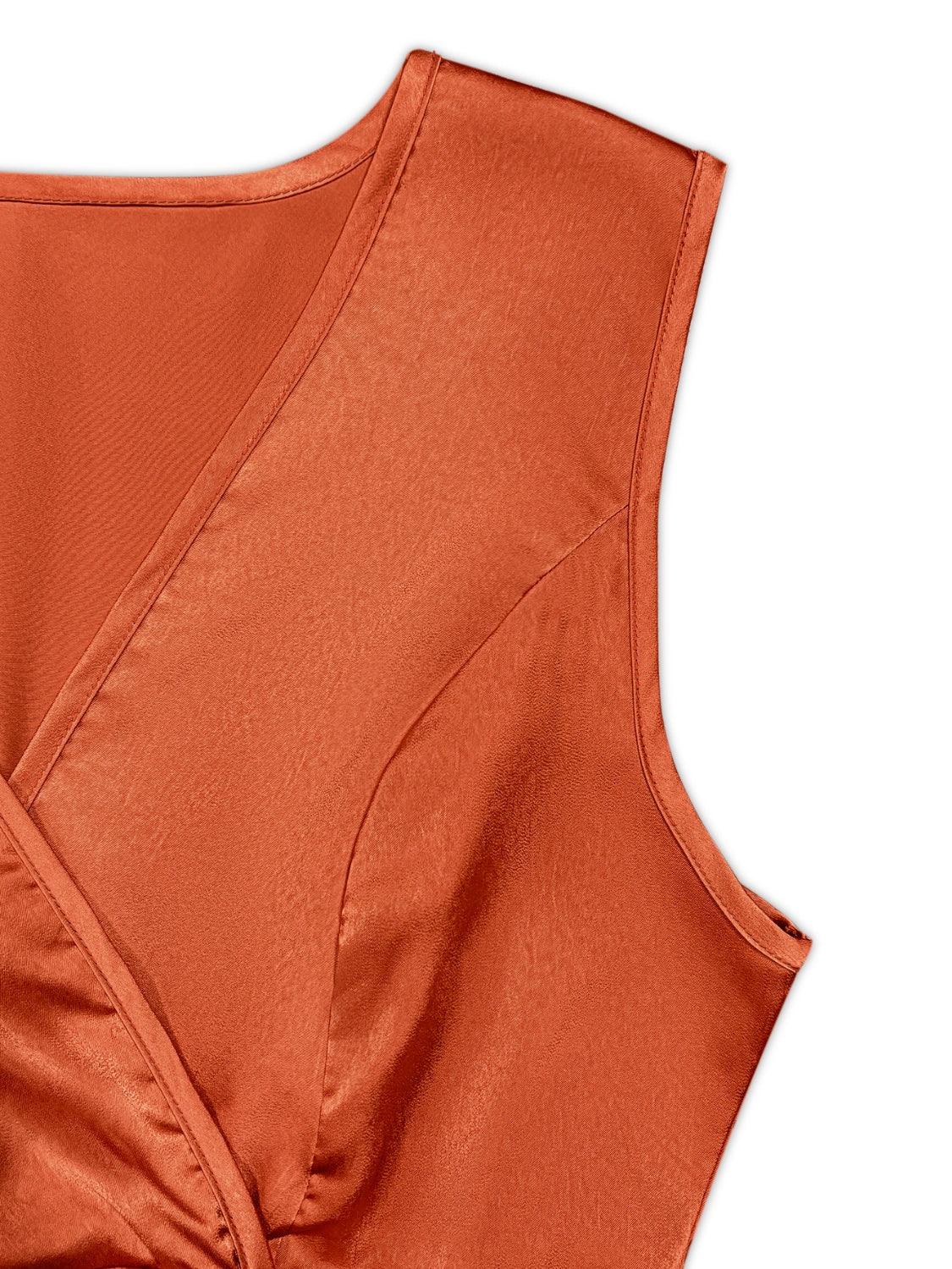 an orange top with a knot on the front