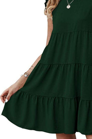 a woman wearing a green dress