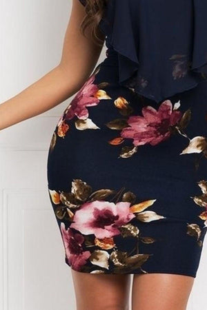 a woman in a dress with flowers on it