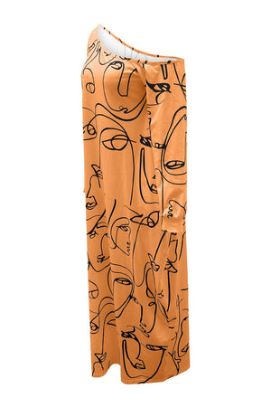 a picture of an orange dress with faces on it