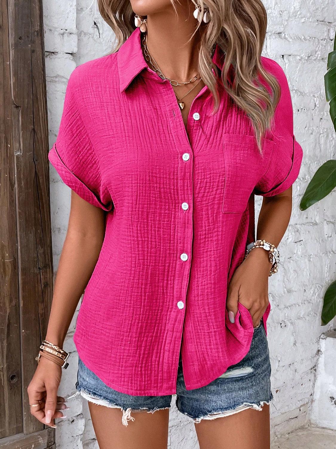 a woman wearing a pink shirt and denim shorts