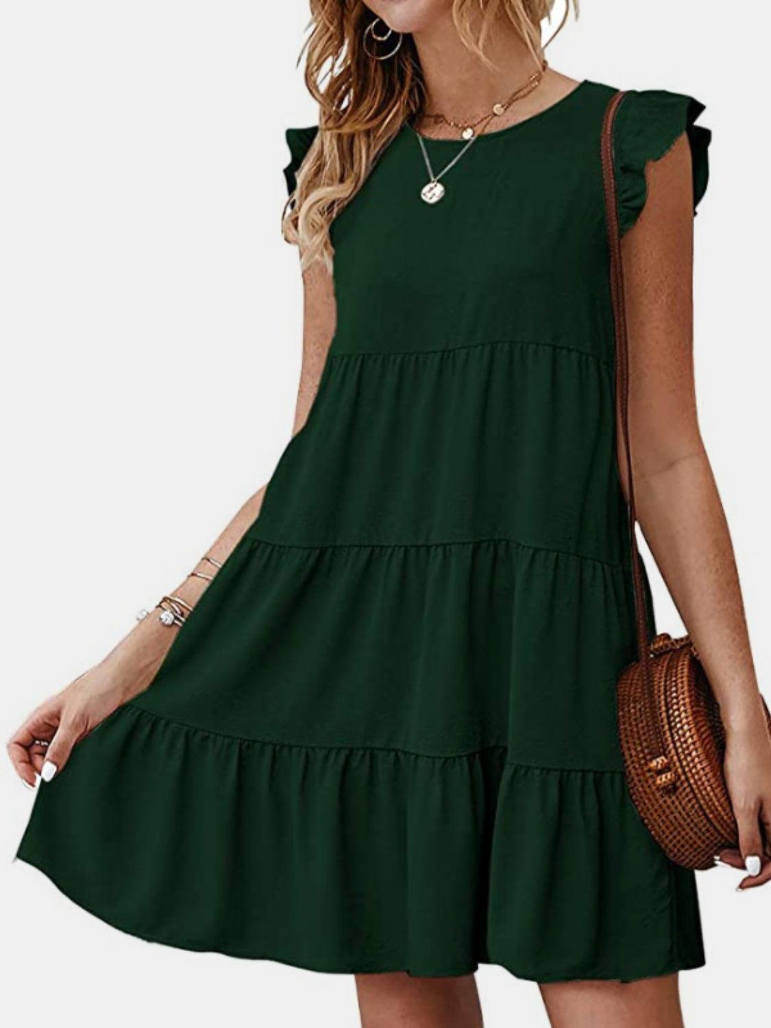 a woman wearing a green dress