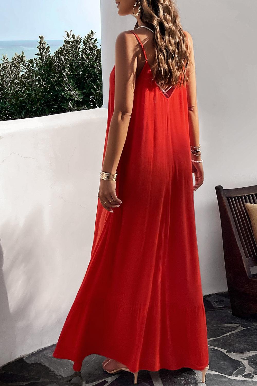 a woman in a red dress standing on a balcony